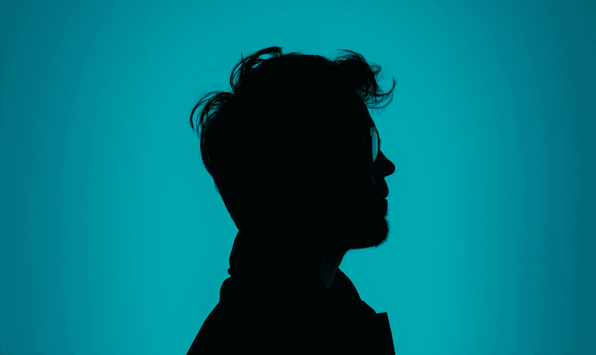 profile silhouette with teal background